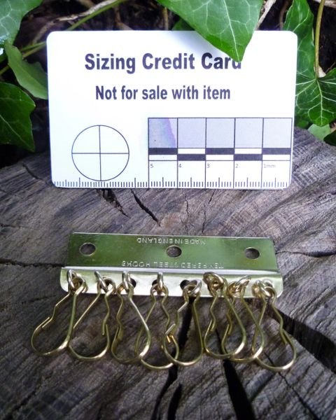 8-hook brass plate is a type of hardware used in leathercraft and other craft projects. Hooks Huggins Attic    [Huggins attic]