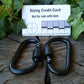 Pairs of Black Screw gate Carabiners. Great to attach to backpacks, bags, keyrings, kettles, tents, and ropes. NOT FOR CLIMBING or HEAVY WEIGHTS Carabiner Huggins Attic    [Huggins attic]