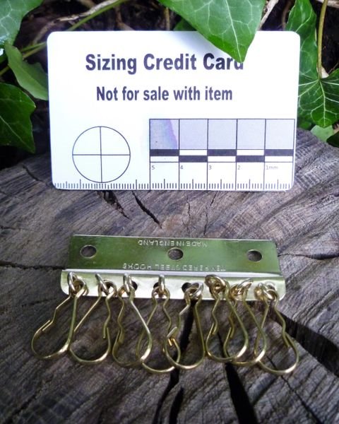 8-hook brass plate- hardware in leathercraft Hooks Huggins Attic    [Huggins attic]