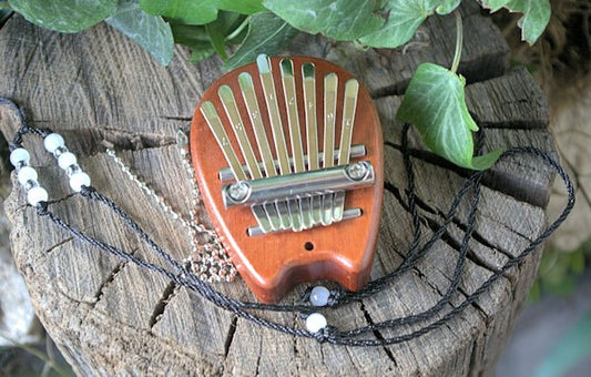 8 Note kalimba also known as a thumb piano, is a delightful musical instrument that's easy to learn and play. Kimbala HugginsAttic    [Huggins attic]