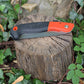 Small folding Orange saw to meet the demands of gardening, camping, hiking, and survival prepping. Folding Saw Hugginsattic    [Huggins attic]
